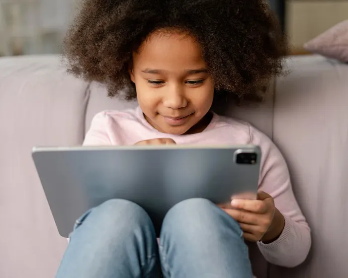 Girl learning on tablet